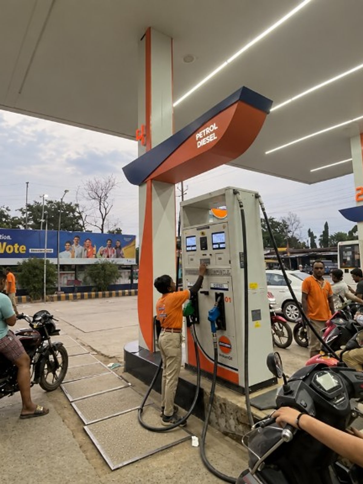 Fuel station owner reviewing staff attendance and shift cash records